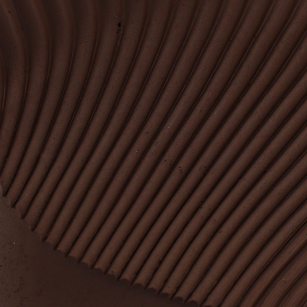 Close-up image of a textured surface featuring evenly spaced, parallel ridges in a deep brown color.