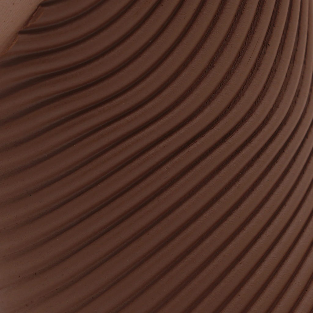 Close-up of textured, curved brown ridges creating a repetitive, wavy pattern.