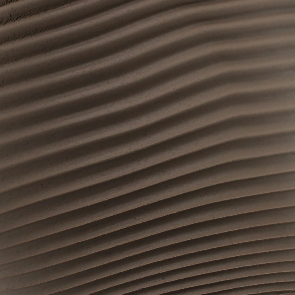 Close-up image of evenly spaced, horizontal brown textured ridges creating a wave-like pattern.