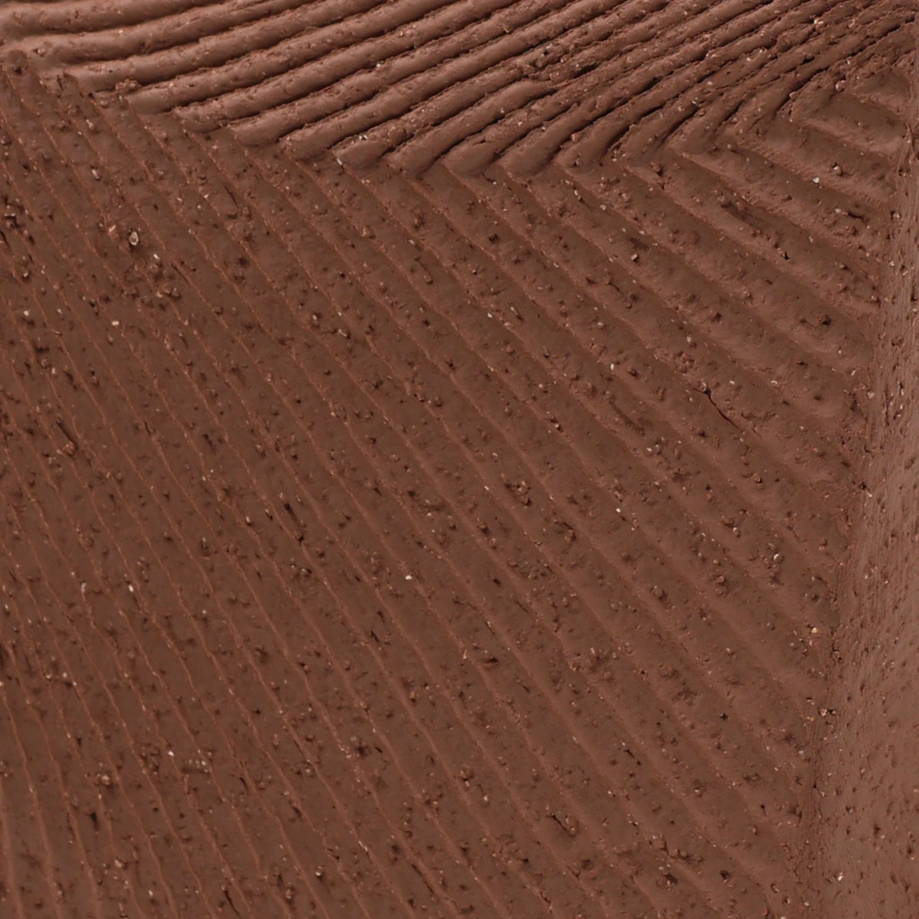 Close-up of textured brown fabric with ribbed and dotted patterns highlighting its woven detail.